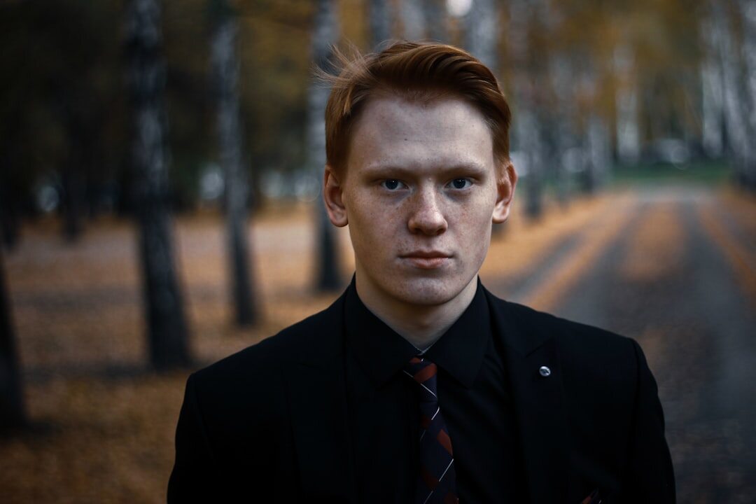 Studio portrait of a Finnish man in his 40s wearing a blazer